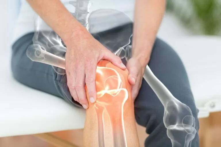 Person experiencing knee pain associated with arthritis